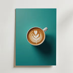 En kopp kaffe med latte art, inspirerad av Barista Flower Coffe Poster från Bozetto, sitter på en teal yta - perfekt för ett premiumpapper med lyxigt matt yta.